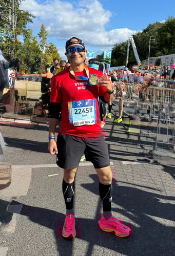 Ravi Kumar, President & CIO of RGBSI, at the 50th Berlin Marathon supporting Free to Run & StrideRise